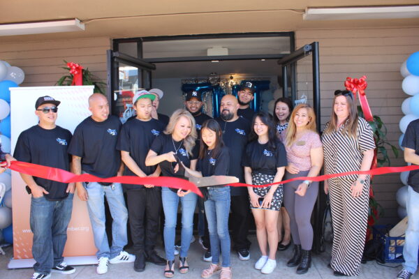 The TNT Mailbox & Shipping team members at the ribbon cutting ceremony.